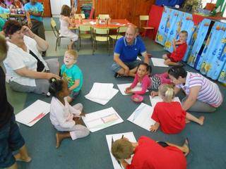 Mommy Nicolene and Jared, Daddy Vernon and Niverne, Mommy Dalné and Lieschen are colouring a picture.