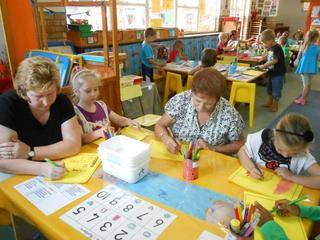 Mom Mareliese, Jaden , Granny Joan and Jemilee are drawing their houses.