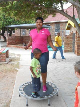 Lizalize and Mom Nomawethu jumps on the trampoline,