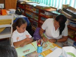 Cara and Aunty Lotoya are also drawing houses.