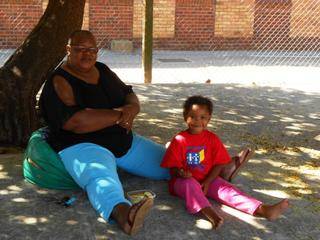 Picnic-time under the tree for Mom Cynthia and Inam from the Red Class.